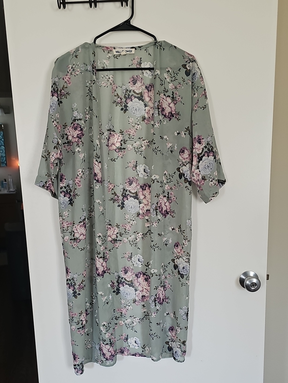 Label reading 'WALLFLOWER' on fabric